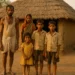 Poor farmer family in front of a thatched hut, rural Uttar Pradesh, 1970s