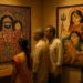 Visitors comparing Odisha’s Pattachitra of Jagannath with Bengal’s Kalighat painting of Goddess Durga at a cultural exhibition.